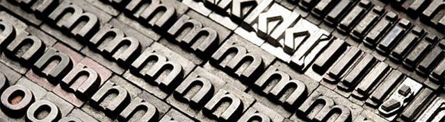 Letterpress - block letter English alphabet and number lighting in studio.